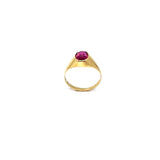 Gold hoop earring with red stone