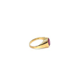 Gold hoop earring with red stone