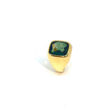 Gold hoop earring with green stone