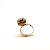 Red gold ring with white stone