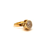 Red gold ring with white stone